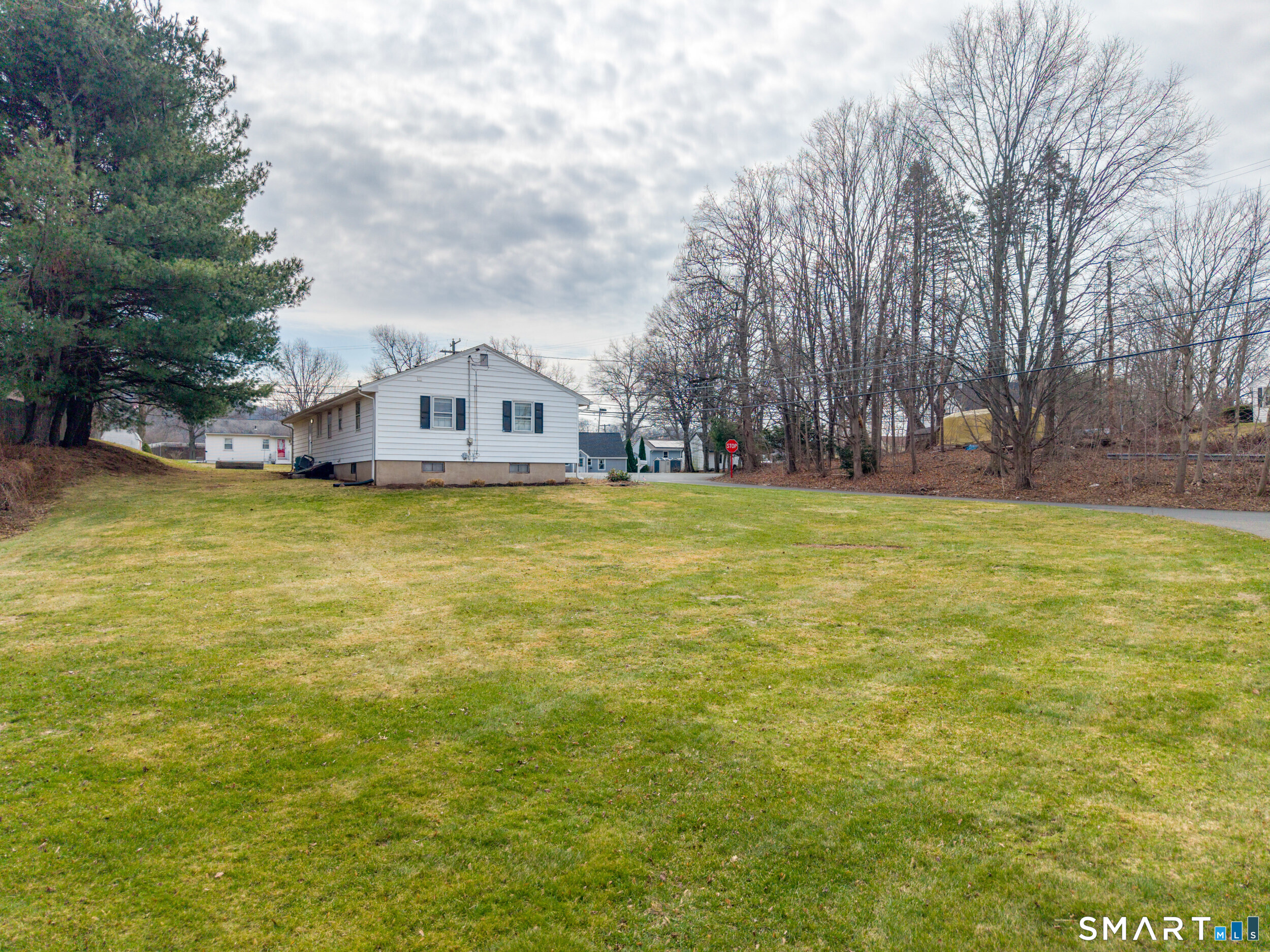 9 Empire Avenue Meriden, CT 06450 - Photo 4 of 31 a view of a large pool with lawn chairs and a big trees
