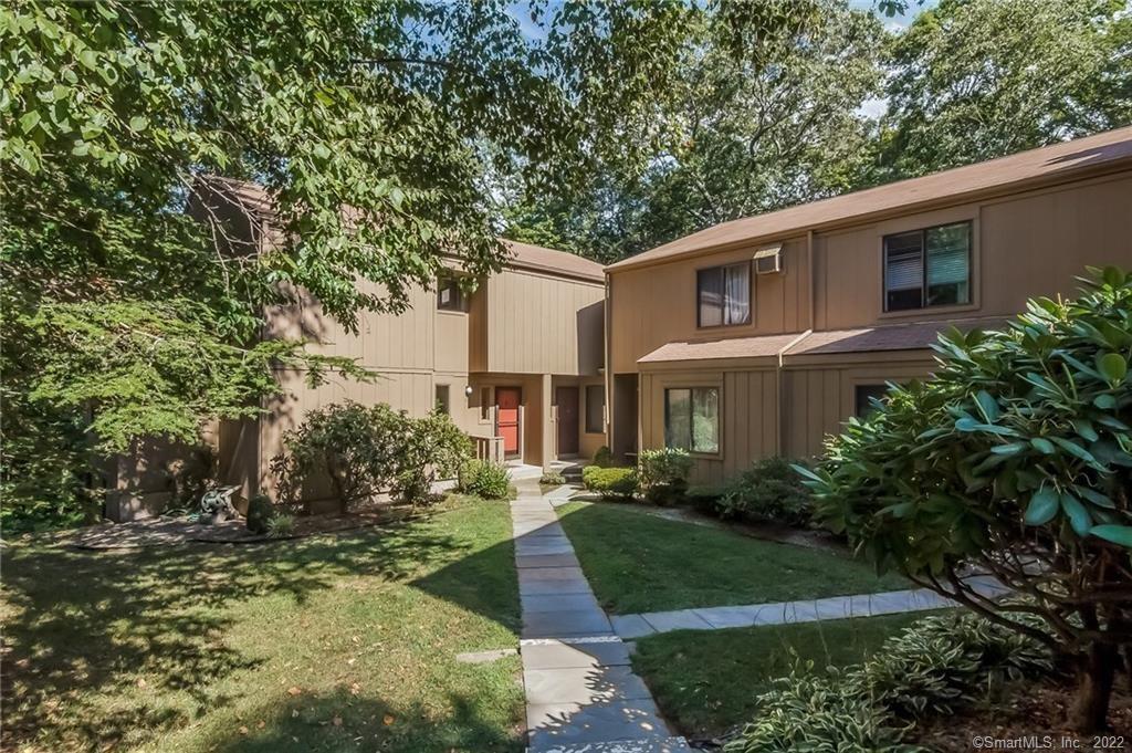 108 Granite Road, Unit 108 Guilford, CT 06437 - Photo 1 of 1 Orange door is the entrance to the property. This end unit only shares one wall with a neighbor ensuring privacy and quiet.