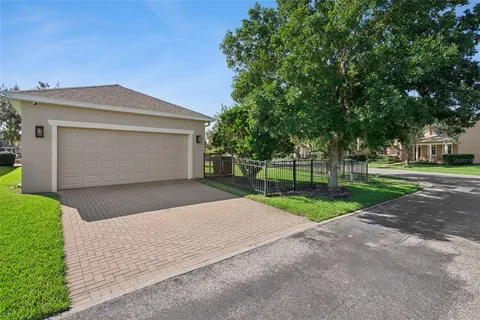 an aerial view of a house with outdoor space and lake view