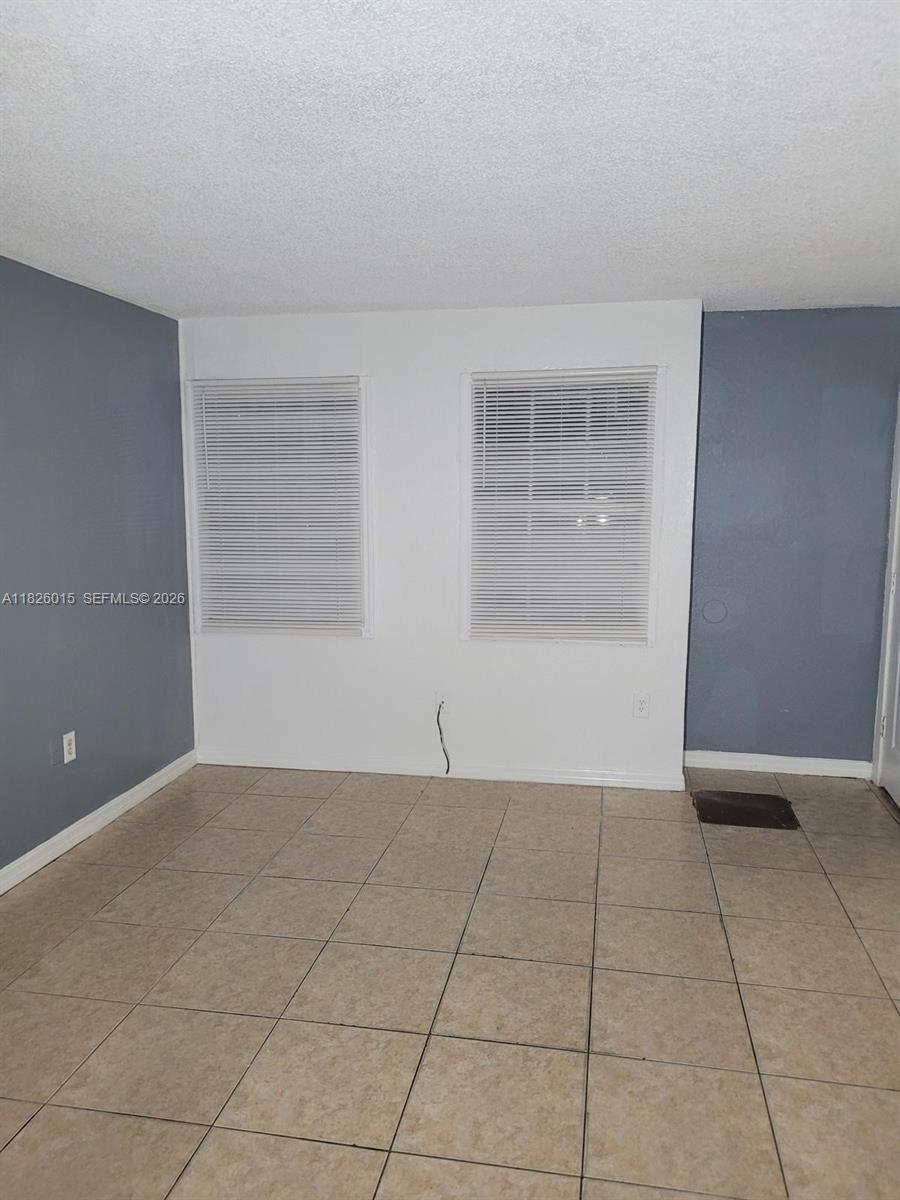 2775-l B L B McLeod Road, Unit B Orlando, FL 32805 - Photo 18 of 28 a view of an empty room with a window