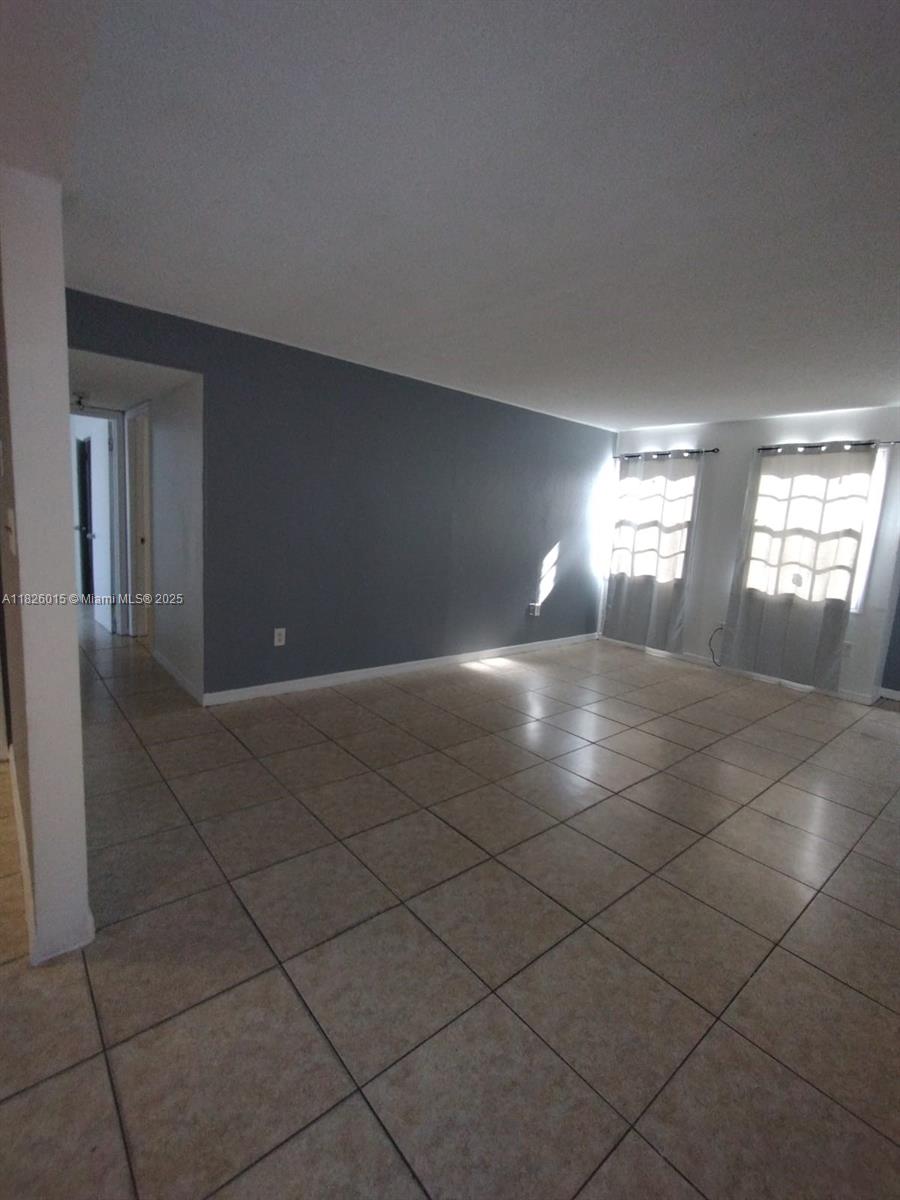 2775-l B L B McLeod Road, Unit B Orlando, FL 32805 - Photo 9 of 13 a view of entryway and hall with a window