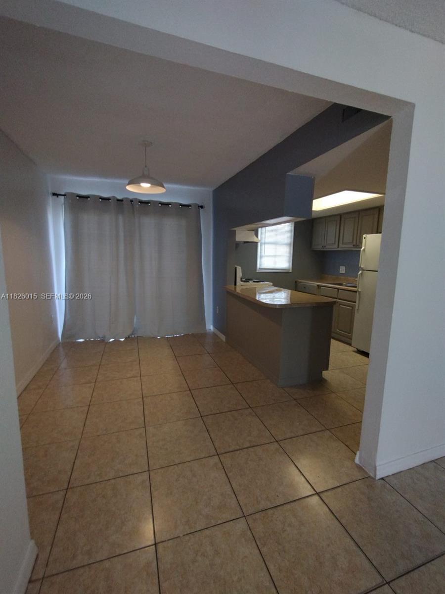 2775-l B L B McLeod Road, Unit B Orlando, FL 32805 - Photo 10 of 28 a room with a washing machine and cabinets