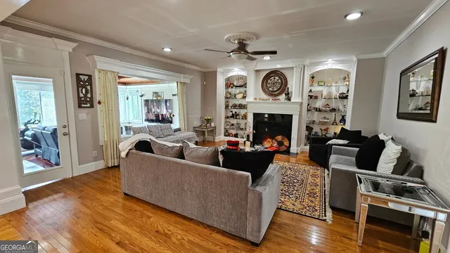 a view of a deck with furniture and garden