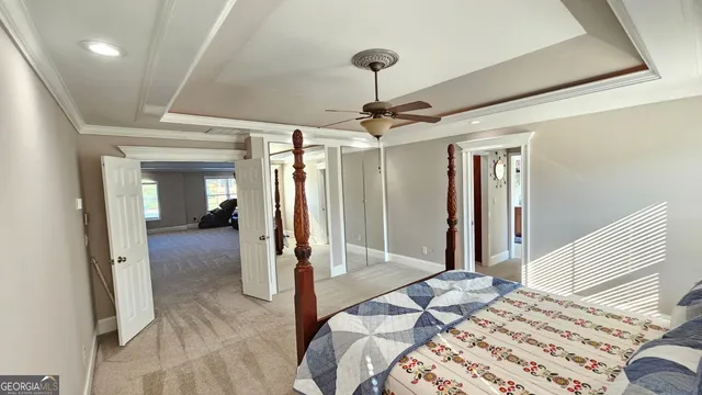 a bathroom with a sink a toilet a mirror and shower