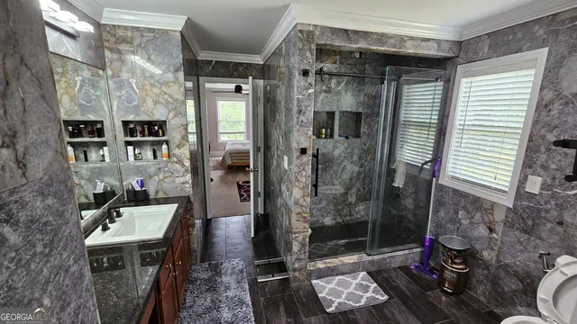 a bathroom with a mirror and a shower