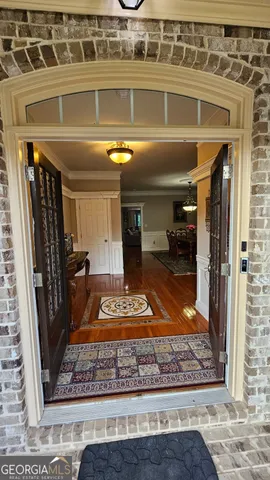 a bathroom with a toilet and a mirror