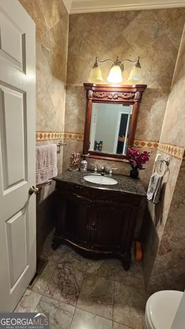 a view of kitchen island with granite countertop living room