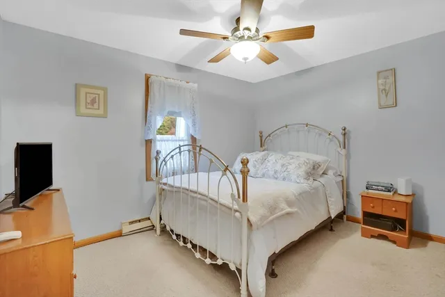 a bedroom with furniture and a chandelier