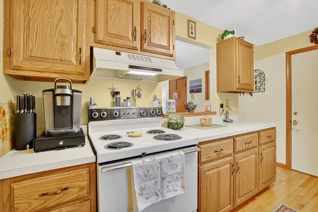a kitchen with stainless steel appliances granite countertop a sink and cabinets