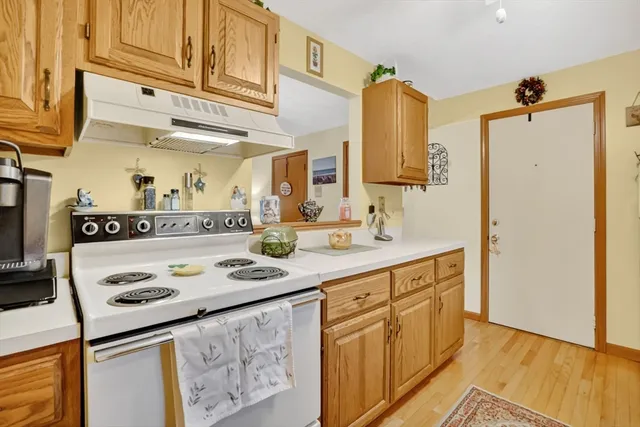 a kitchen with stainless steel appliances granite countertop a sink and cabinets