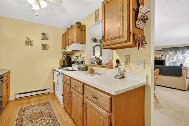 a kitchen with stainless steel appliances granite countertop a sink and a stove with granite countertops