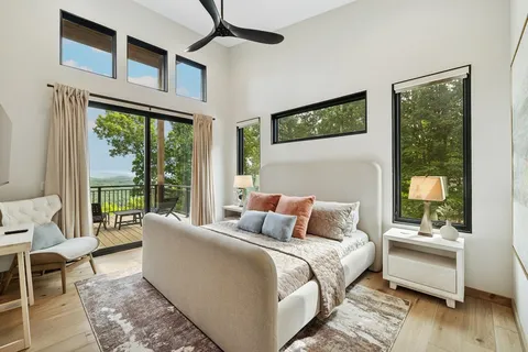 a white bath tub sitting next to a window