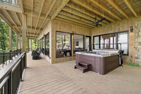 a view of a balcony with wooden floor