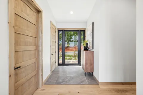 a bathroom with a sink mirror and toilet
