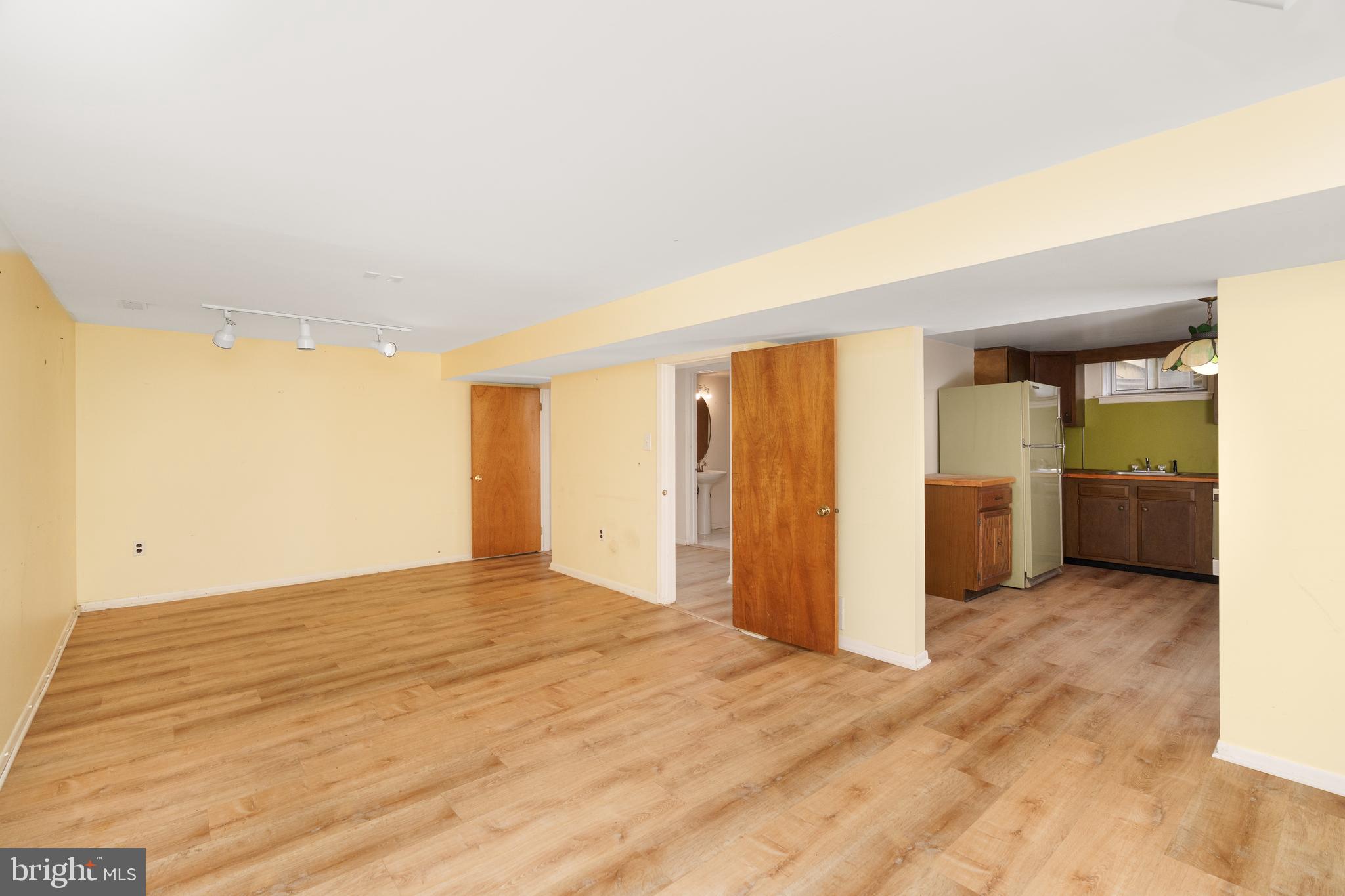 112 Park Towne Drive Elkton, MD 21921 - Photo 13 of 18 a view of an empty room with kitchen and a window
