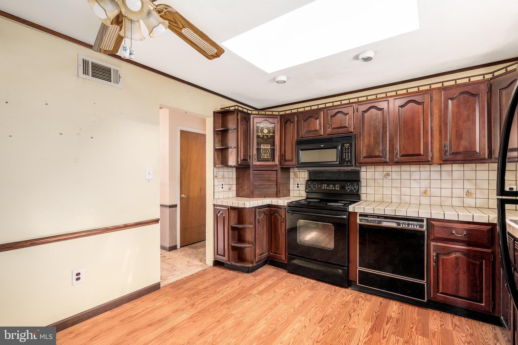 112 Park Towne Drive Elkton, MD 21921 - Photo 3 of 18 a kitchen with stainless steel appliances granite countertop a stove and a refrigerator