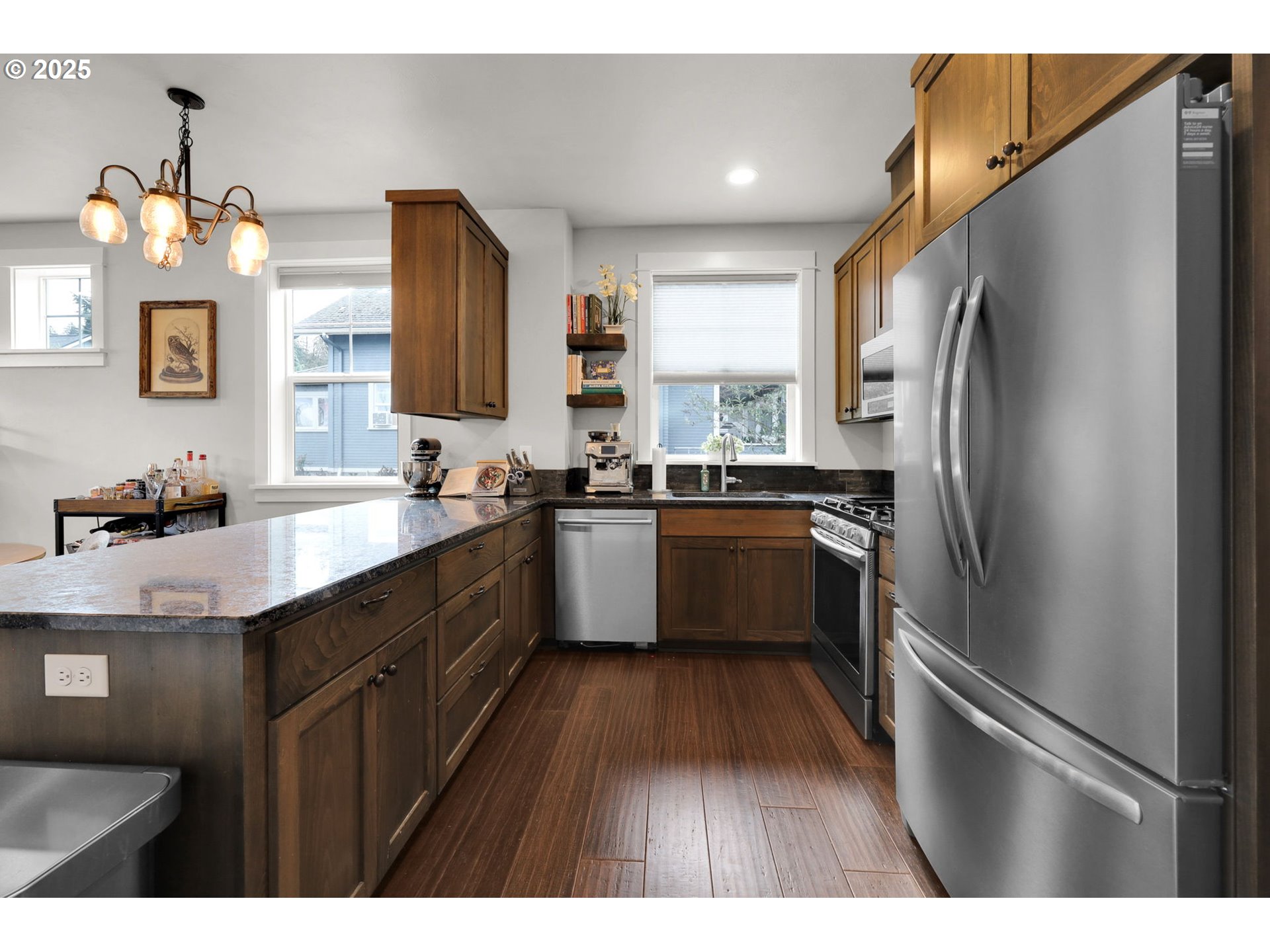 2819 Adams Street Eugene, OR 97405 - Photo 13 of 44 a kitchen with a sink refrigerator and cabinets