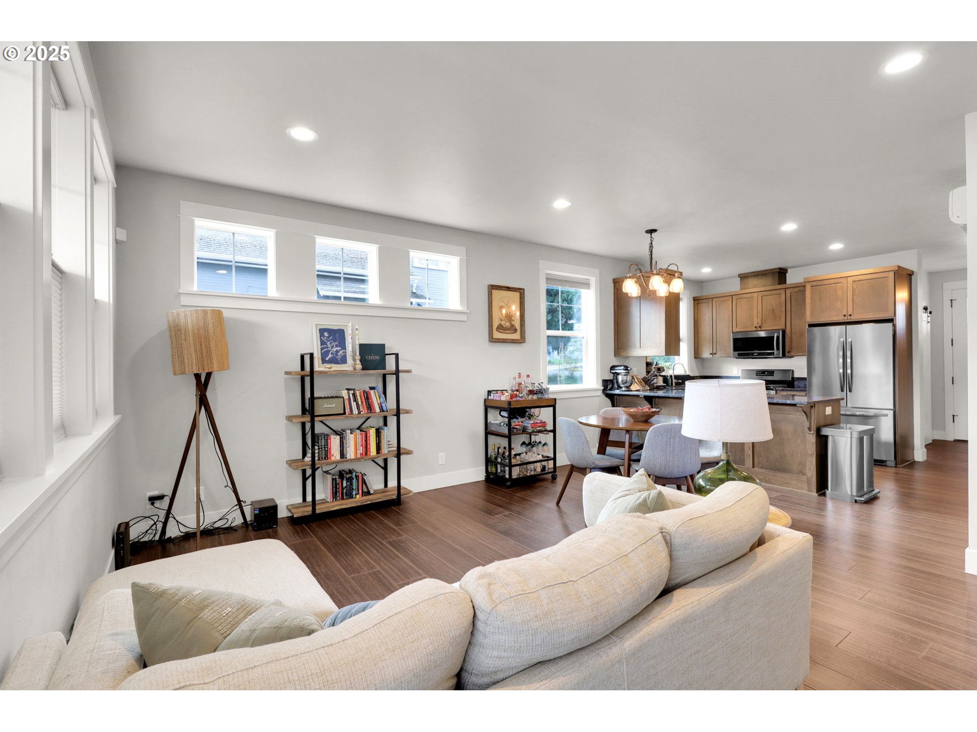 2819 Adams Street Eugene, OR 97405 - Photo 18 of 44 a living room with furniture kitchen view and a wooden floor