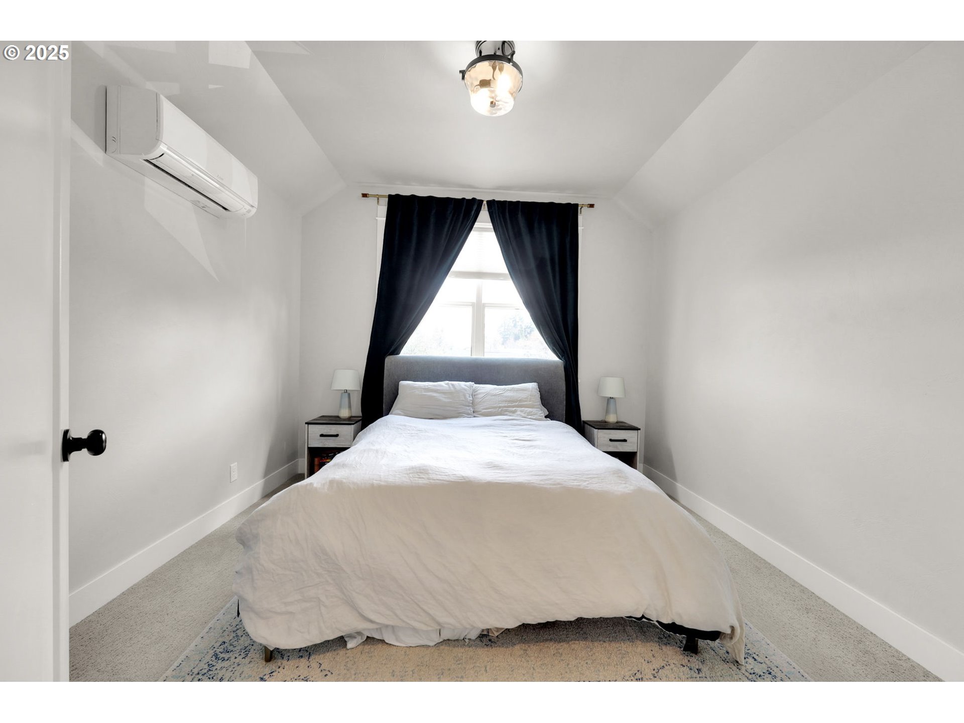 2819 Adams Street Eugene, OR 97405 - Photo 27 of 44 a bedroom with a bed and a window