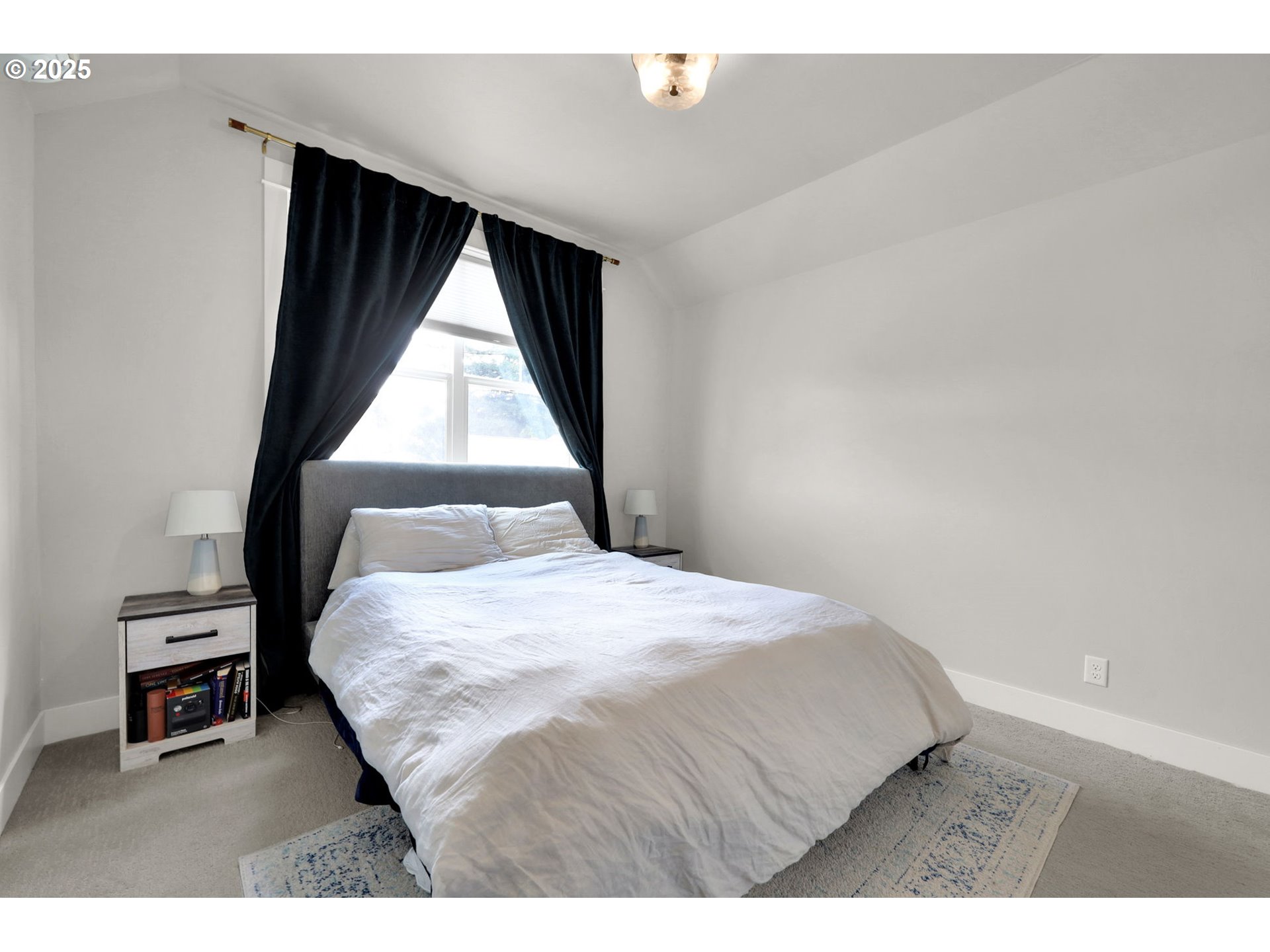 2819 Adams Street Eugene, OR 97405 - Photo 28 of 44 a bedroom with a bed and a window