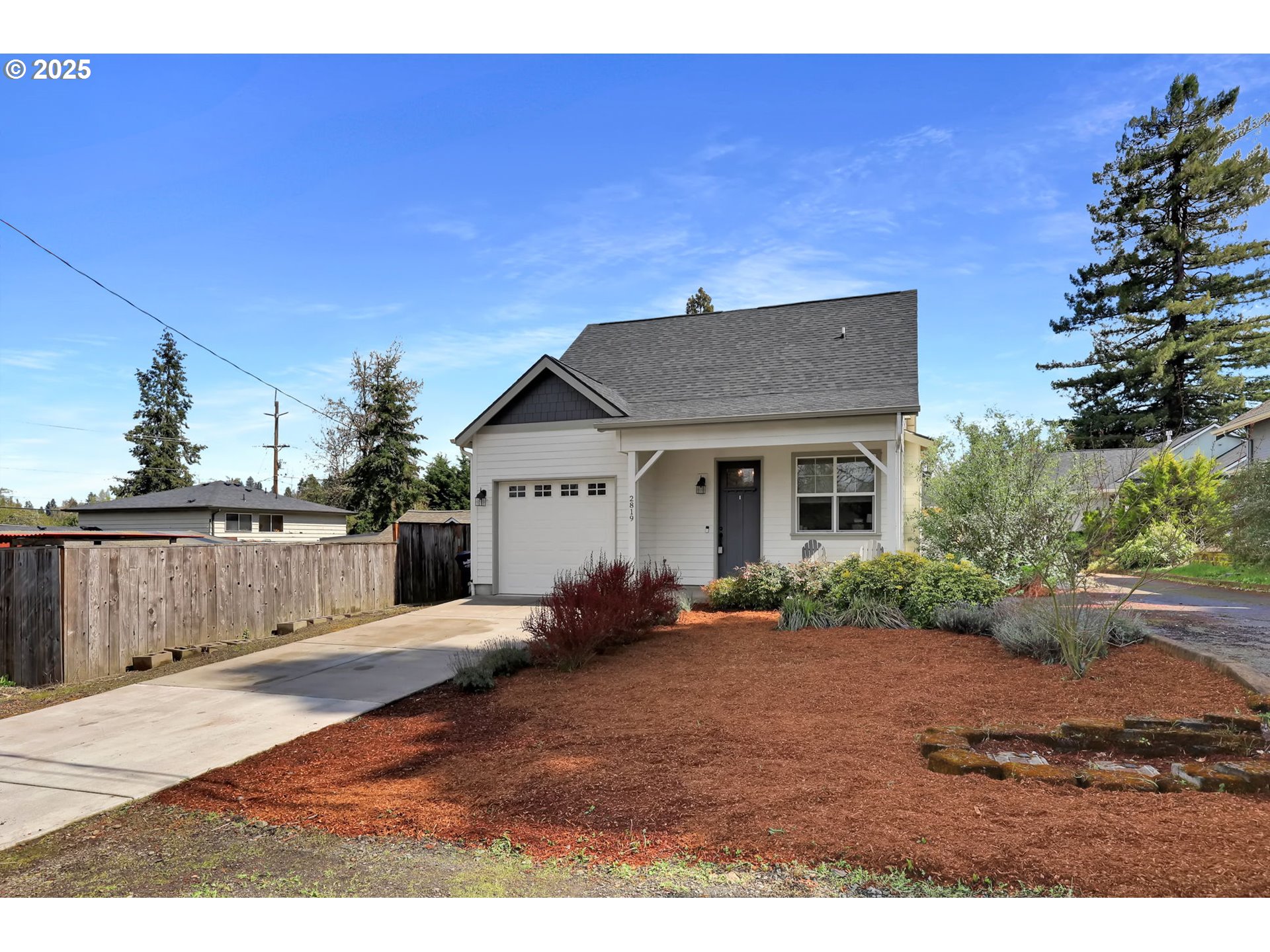 2819 Adams Street Eugene, OR 97405 - Photo 3 of 44 a backyard of a house with yard and outdoor seating