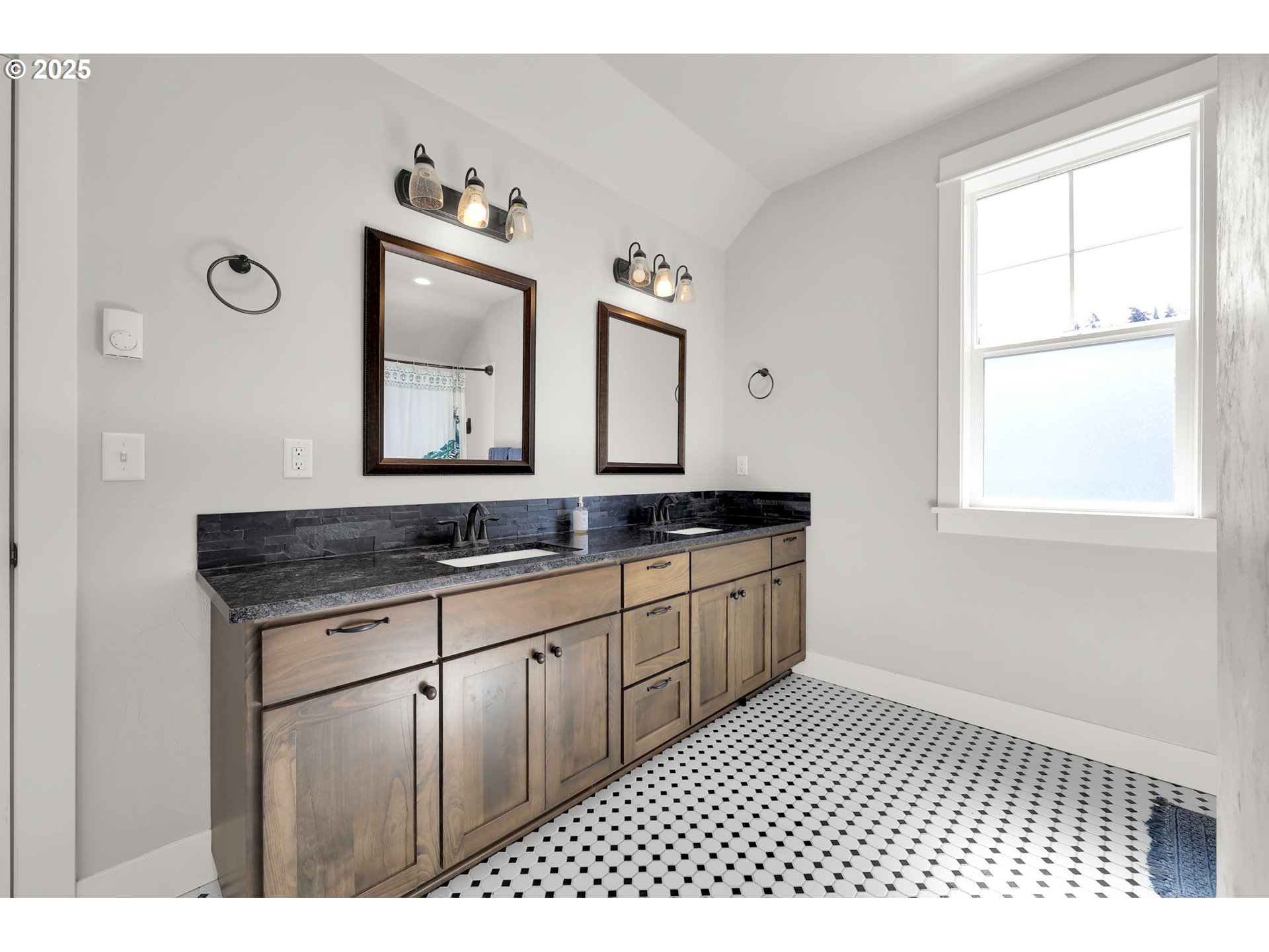 2819 Adams Street Eugene, OR 97405 - Photo 34 of 44 a bathroom with a sink a large mirror and a window