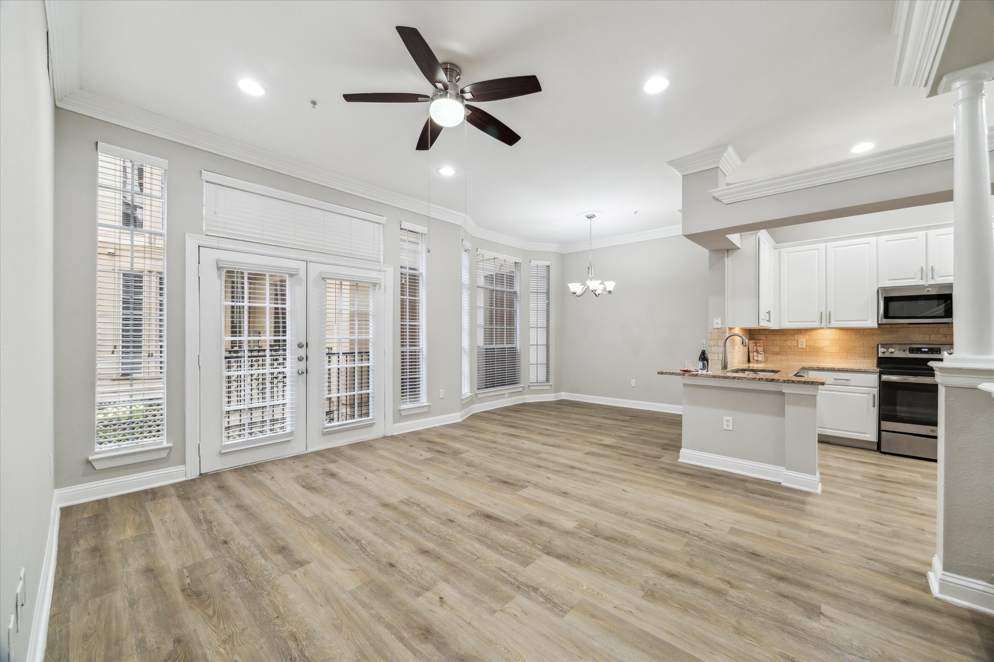 a view of kitchen with sink microwave and stove