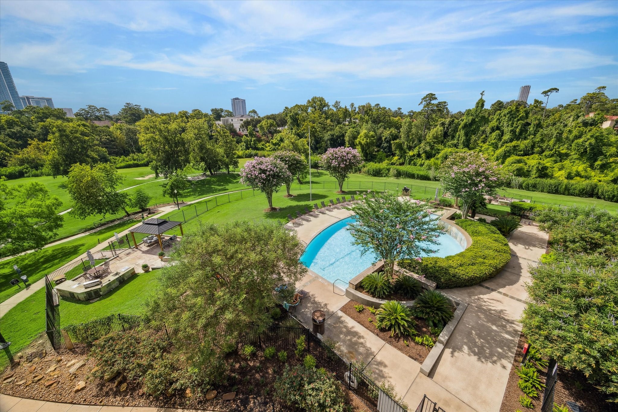 5353 Memorial Drive, Unit 3038 Houston, TX 77007 - Photo 14 of 27 a view of a garden with a building in the background