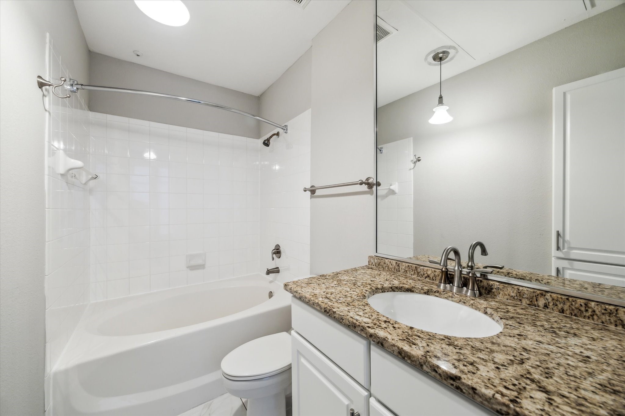 5353 Memorial Drive, Unit 3038 Houston, TX 77007 - Photo 8 of 27 a bathroom with a granite countertop sink toilet and shower