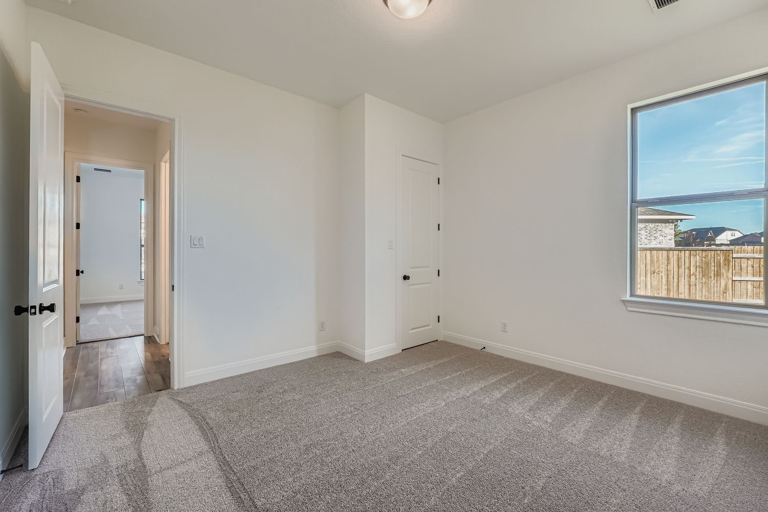 480 Prickly Poppy Loop Kyle, TX 78640 - Photo 8 of 11 an empty room with windows and closet