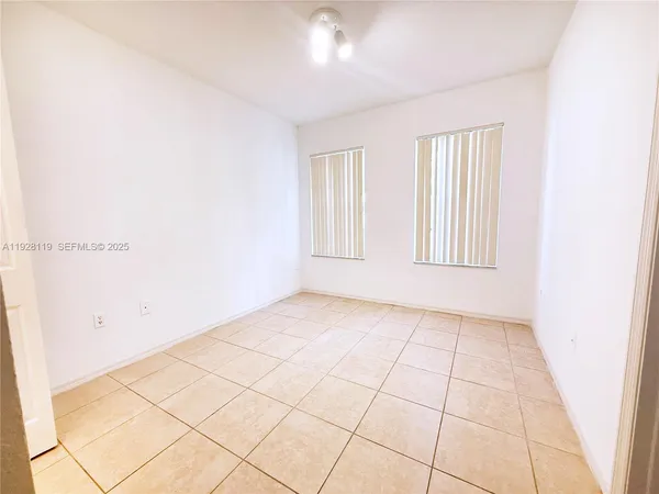an empty room with a bathroom