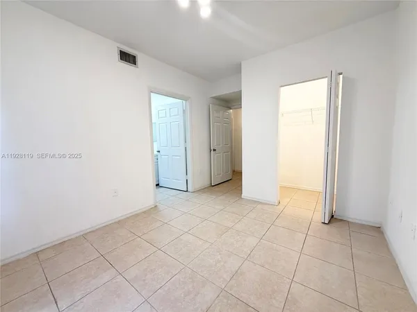 an empty room with a bench