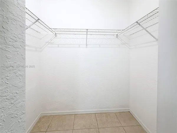 a bathroom with a toilet a sink a vanity and mirror