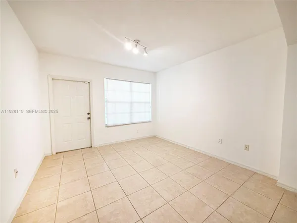 an empty room with white walls