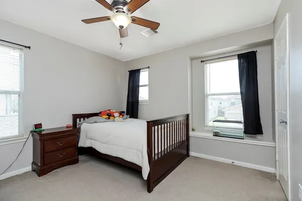 a bed room with a bed and a window