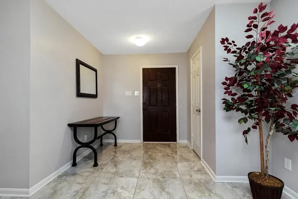 a view of wooden floor and a potted plant