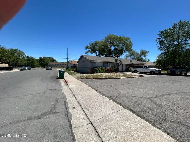 a view of swimming pool with outdoor seating and plants