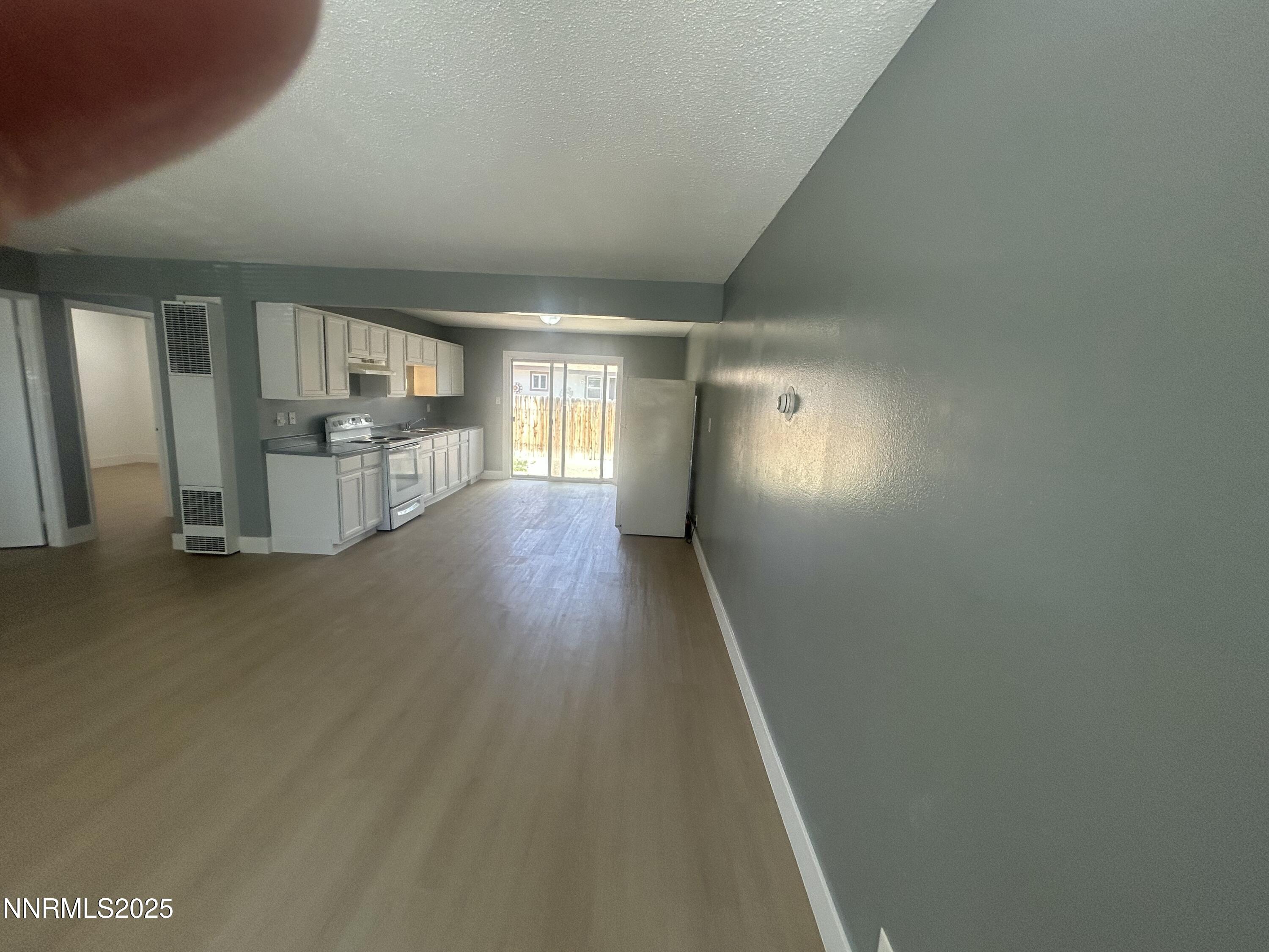 1250 Virbel Lane Reno, NV 89502 - Photo 2 of 5 a view of hallway with wooden floor