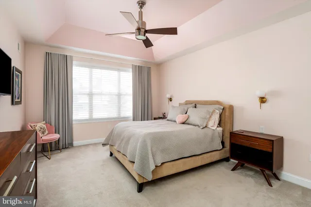 a bed room with a bed and a window