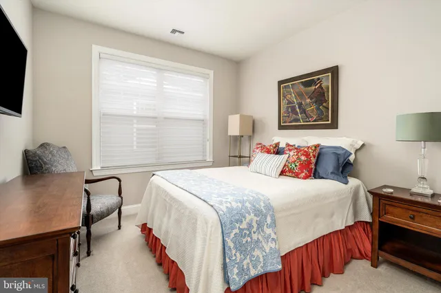 a bedroom with double bed and a window