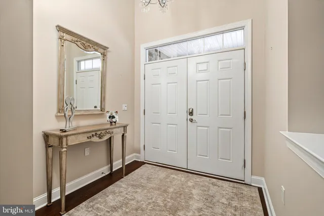 a view of a kitchen with stainless steel appliances granite countertop a stove and a refrigerator