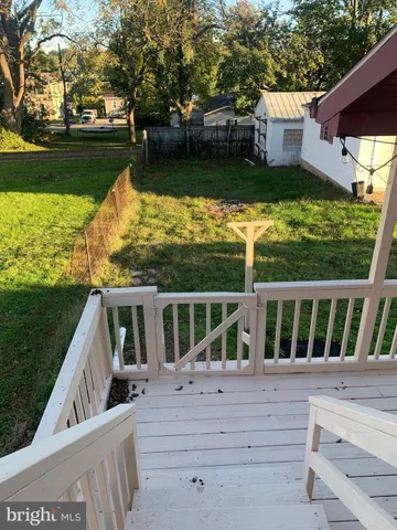 a view of house with swimming pool outdoor seating