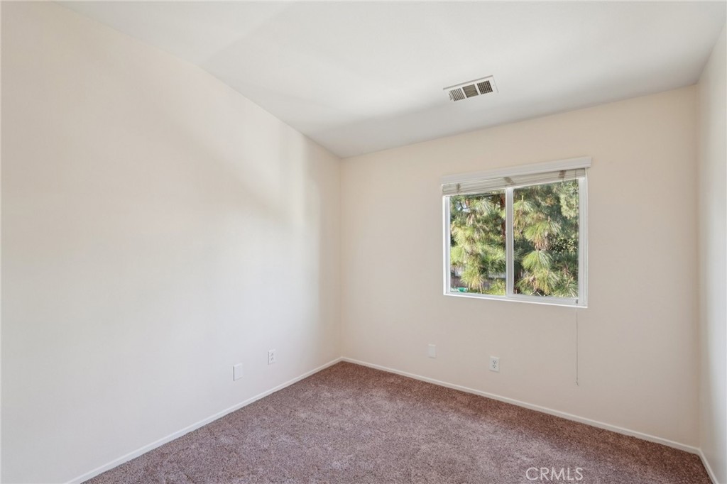 1793 Agrigento Avenue Riverside, CA 92507 - Photo 15 of 34 an empty room with windows
