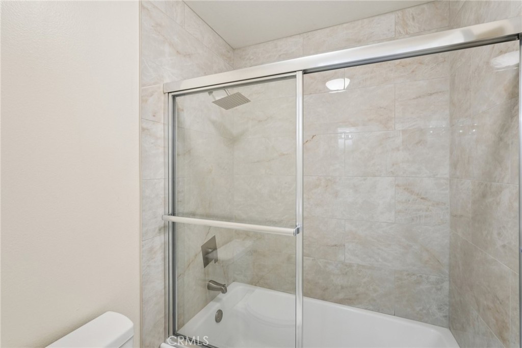 1793 Agrigento Avenue Riverside, CA 92507 - Photo 18 of 34 a bathroom with a shower and toilet