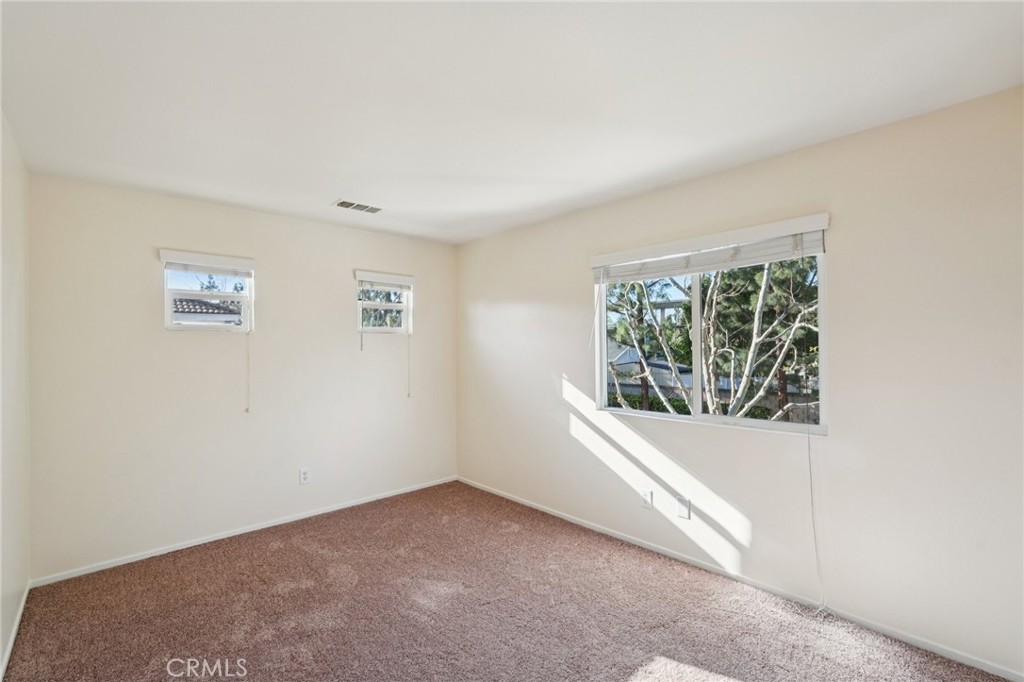 1793 Agrigento Avenue Riverside, CA 92507 - Photo 20 of 34 an empty room with windows