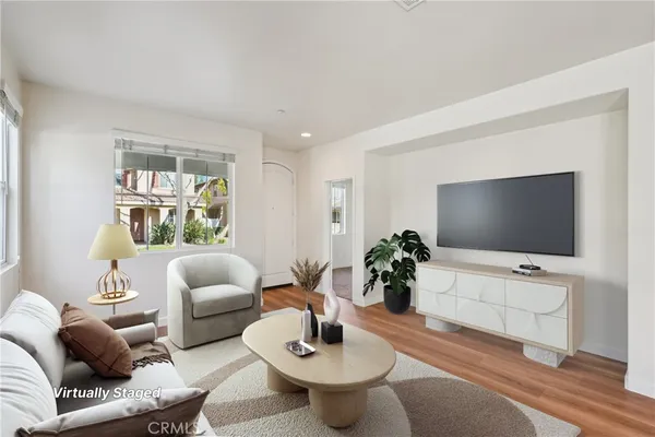 a view of kitchen with wooden floor and electronic appliances