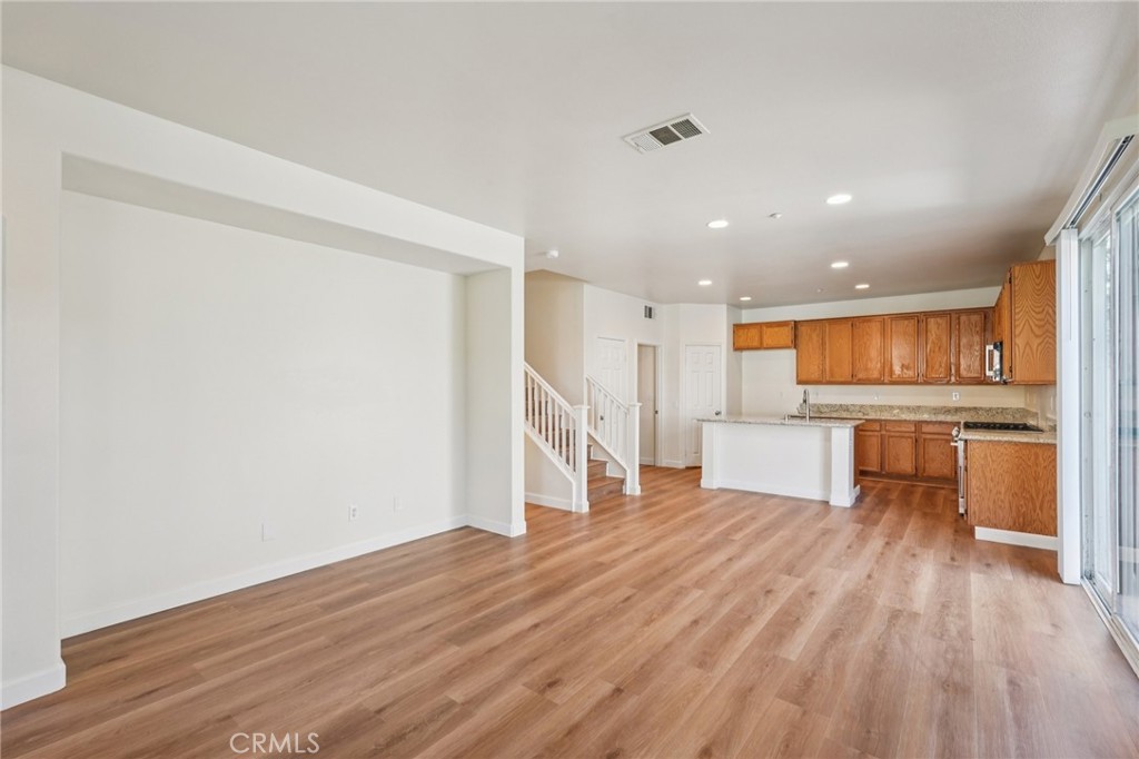 1793 Agrigento Avenue Riverside, CA 92507 - Photo 5 of 34 a view of kitchen with wooden floor and electronic appliances