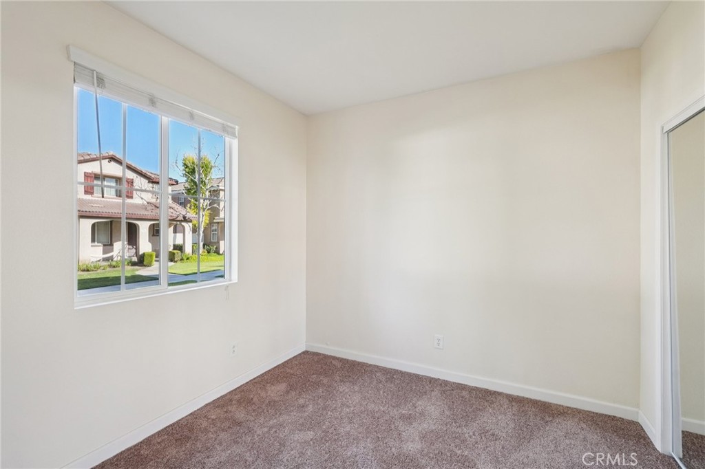 1793 Agrigento Avenue Riverside, CA 92507 - Photo 9 of 34 a view of an empty room with a window