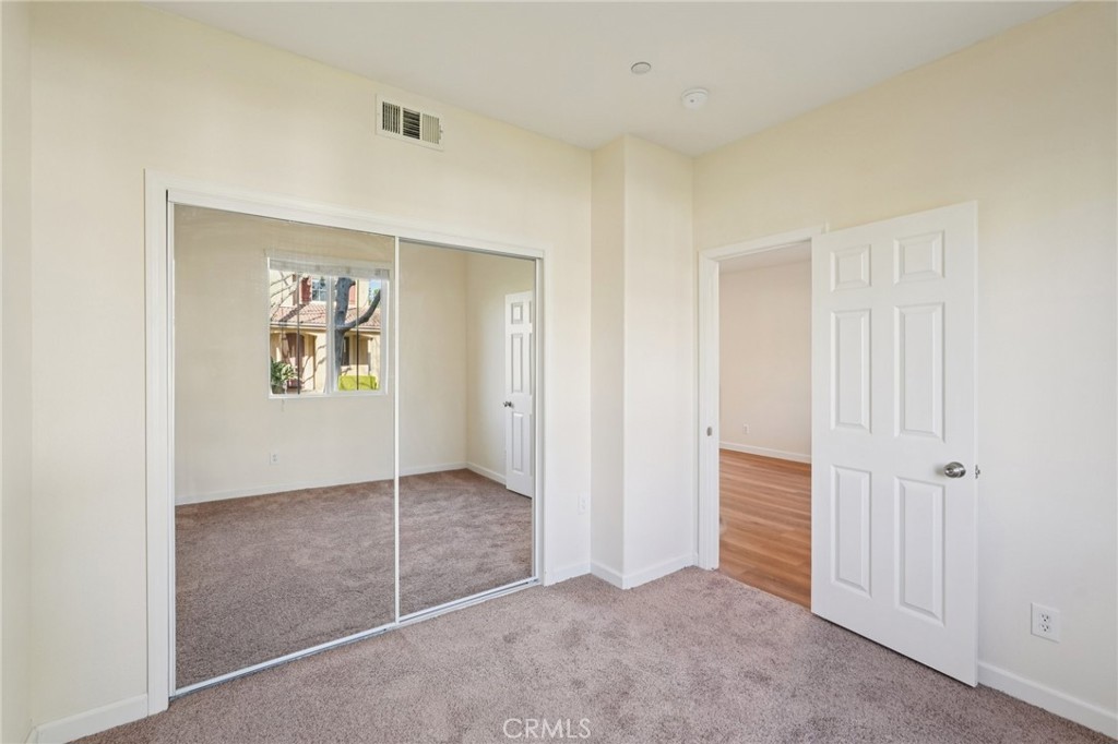 1793 Agrigento Avenue Riverside, CA 92507 - Photo 10 of 34 an empty room with windows and closet