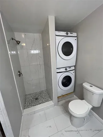a bathroom with a toilet and a sink